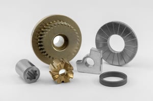 Powder metal components demonstrating design for cost reduction in manufacturing.