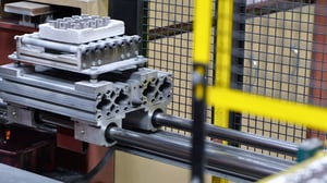 Parts entering a furnace during the sintering process in powder metallurgy