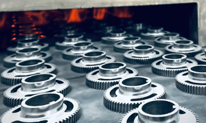 Metal components entering a sintering furnace for an article on metal powder sintering